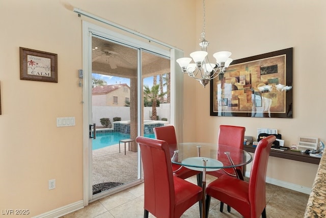 dining area featuring light tile patterned floors and a chandelier