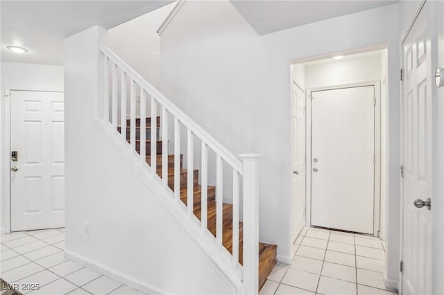 entrance foyer featuring light tile patterned flooring