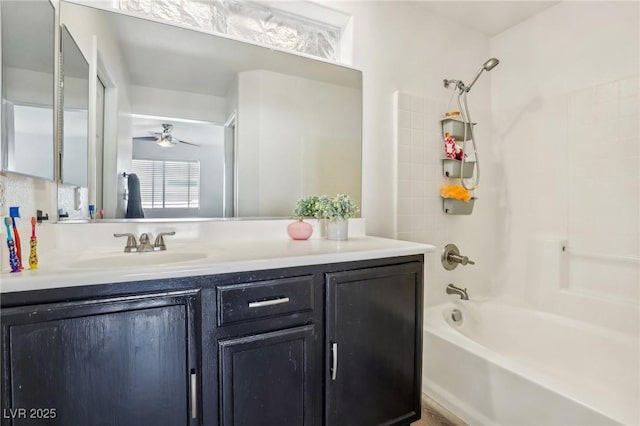 bathroom with ceiling fan, shower / washtub combination, and vanity