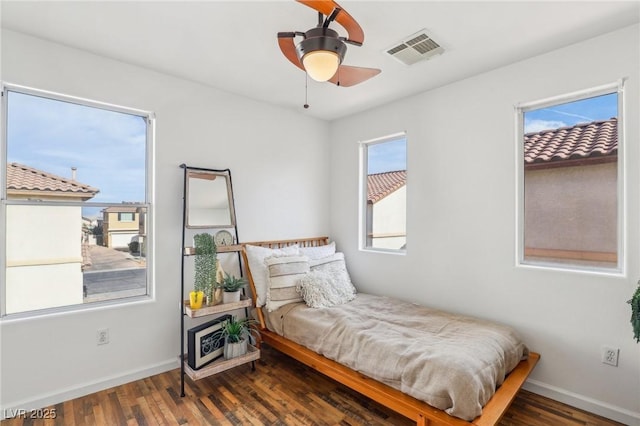 bedroom featuring ceiling fan and dark hardwood / wood-style floors