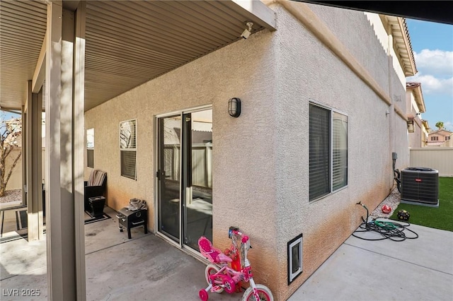 exterior space featuring a patio and central air condition unit