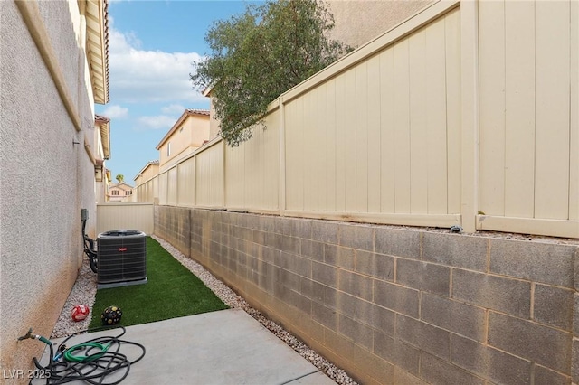 exterior space featuring central AC and a patio area