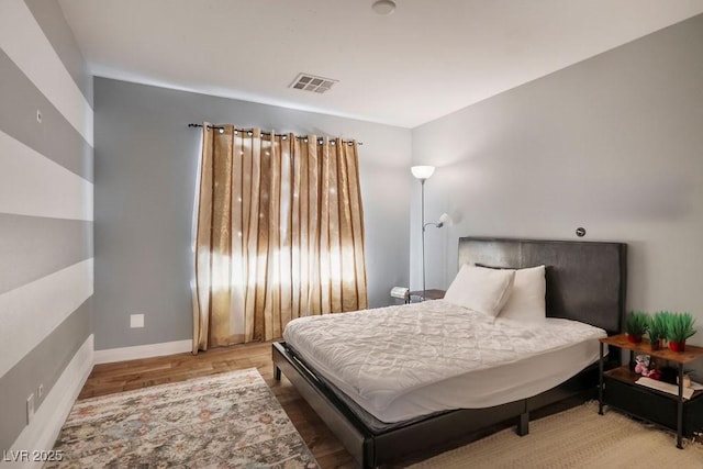 bedroom with light wood-type flooring