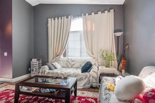 living area with vaulted ceiling