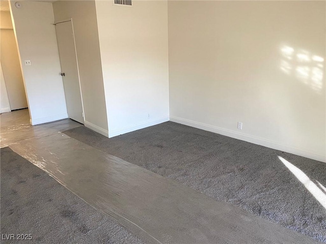 empty room with concrete flooring