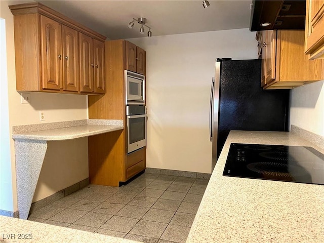 kitchen with stainless steel appliances and extractor fan