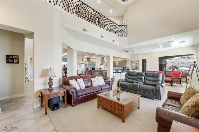 living room with a high ceiling