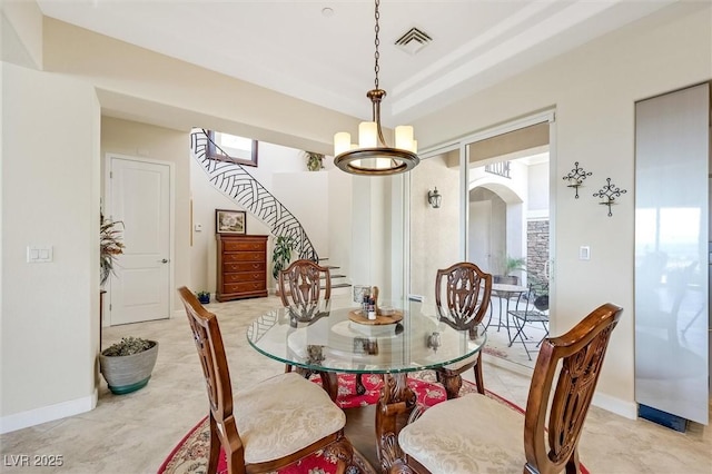 dining room featuring a notable chandelier