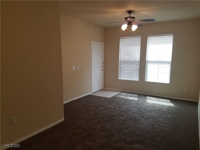 unfurnished room featuring ceiling fan and light colored carpet