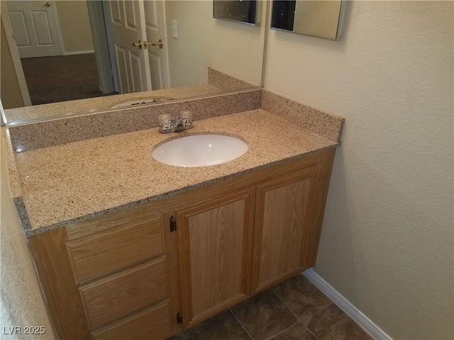 bathroom featuring tile patterned floors and vanity