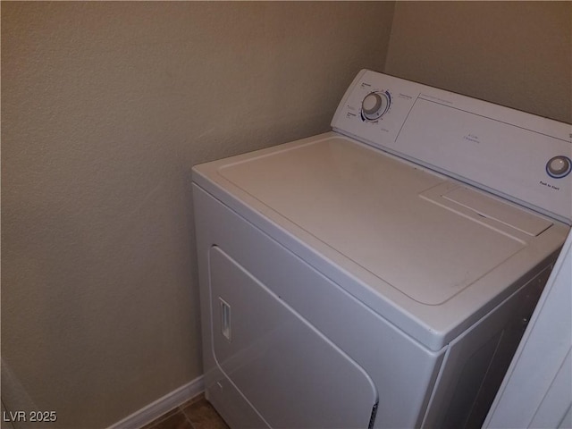 washroom featuring tile patterned flooring and washer / clothes dryer