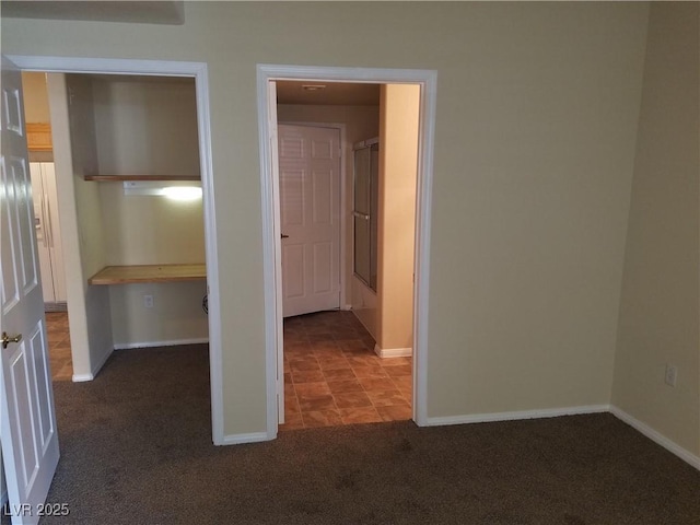 interior space with dark colored carpet