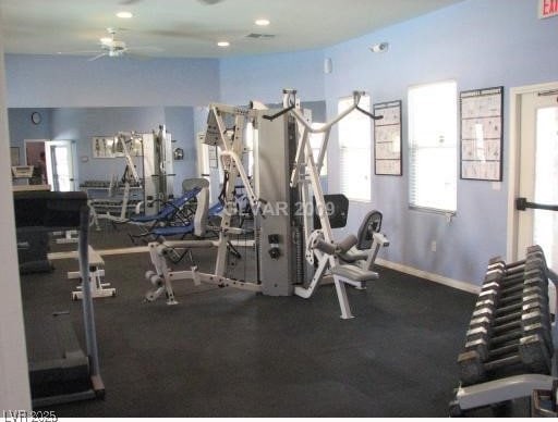 exercise room with ceiling fan