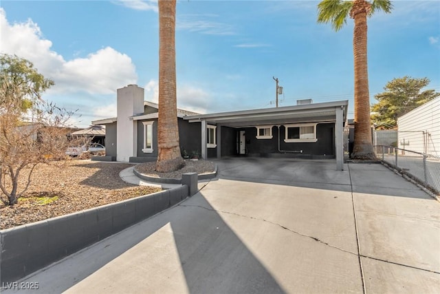 view of front of house with a carport