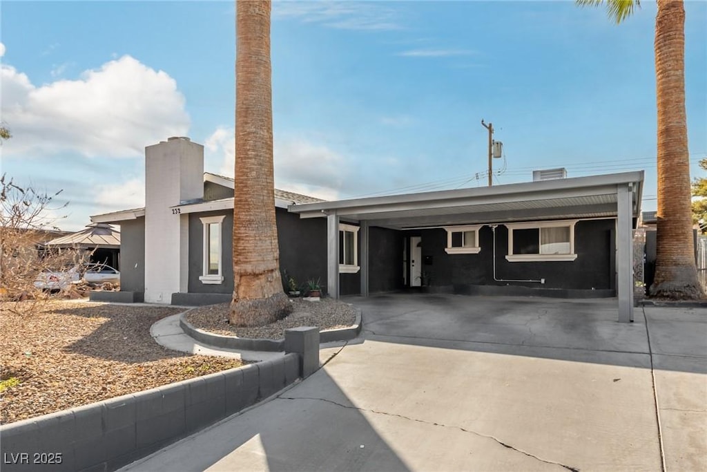 view of front of property with a carport