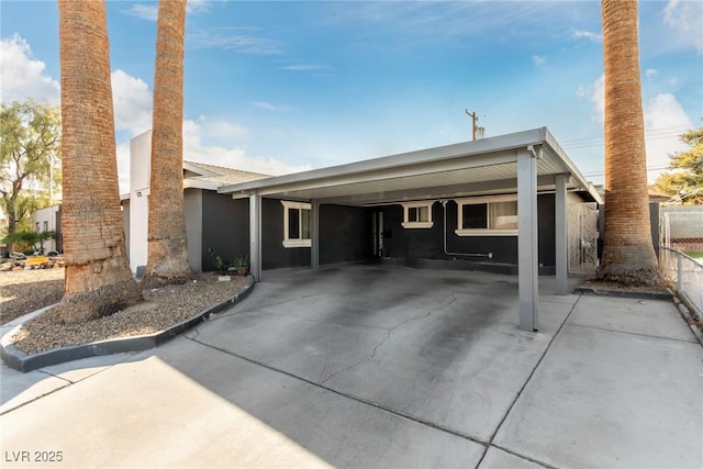 view of front of property featuring a carport