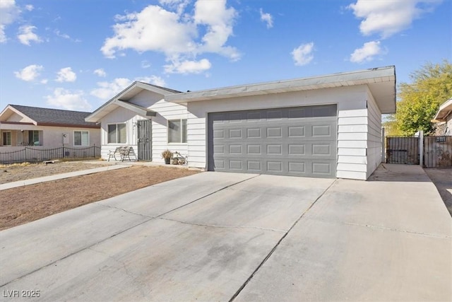 ranch-style home featuring a garage