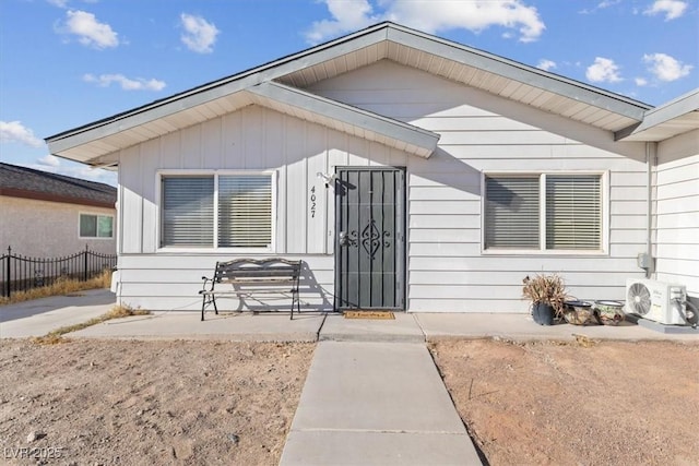 view of exterior entry featuring ac unit