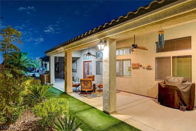 view of patio featuring ceiling fan