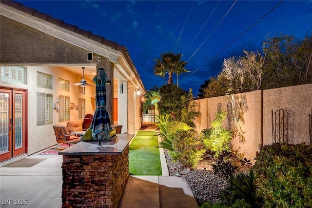 patio at twilight with ceiling fan