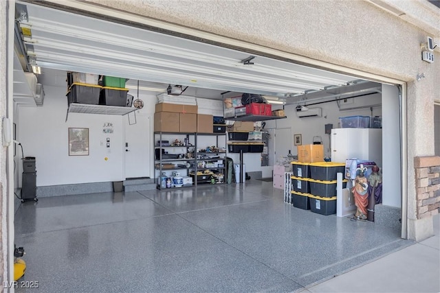 garage with a wall mounted air conditioner