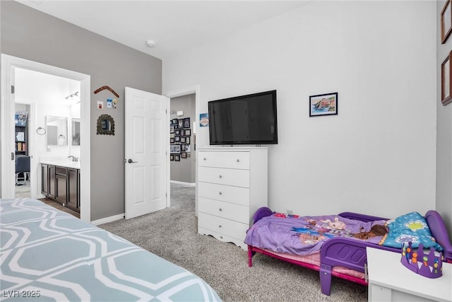 carpeted bedroom featuring connected bathroom