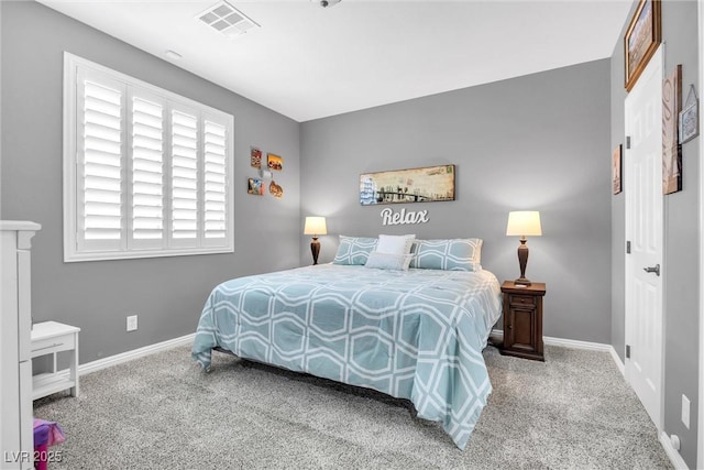 bedroom featuring light carpet