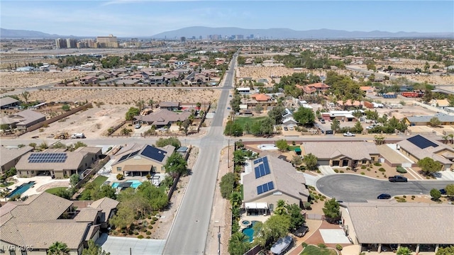 birds eye view of property featuring a mountain view