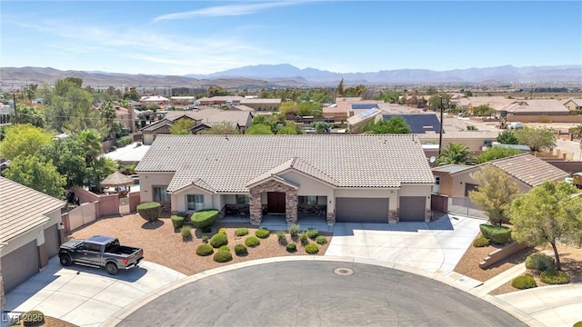 birds eye view of property featuring a mountain view