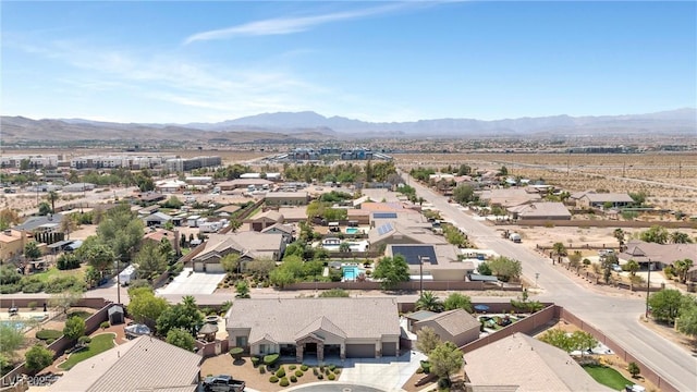 birds eye view of property with a mountain view