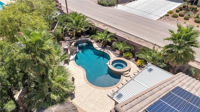 view of pool featuring an in ground hot tub and a patio