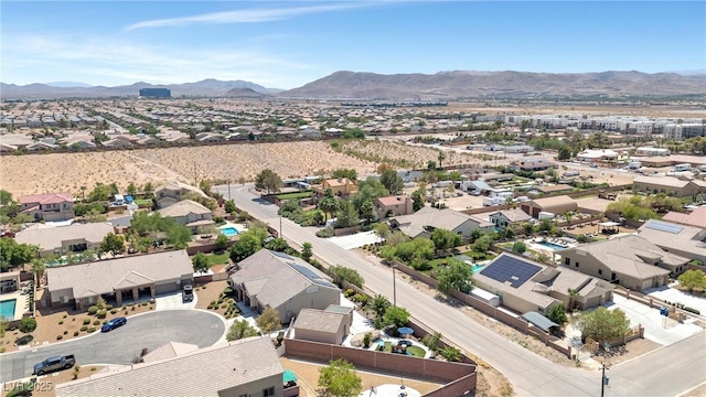 birds eye view of property featuring a mountain view