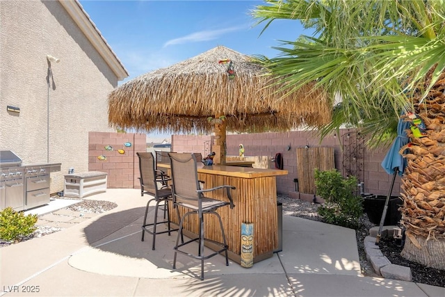 view of patio / terrace featuring a bar