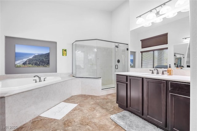 bathroom with independent shower and bath and vanity