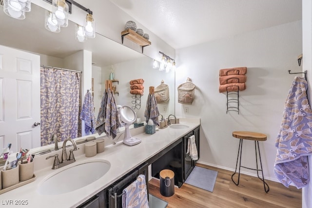 bathroom featuring vanity and hardwood / wood-style flooring