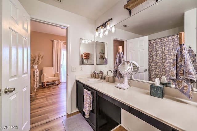 bathroom featuring hardwood / wood-style floors and vanity