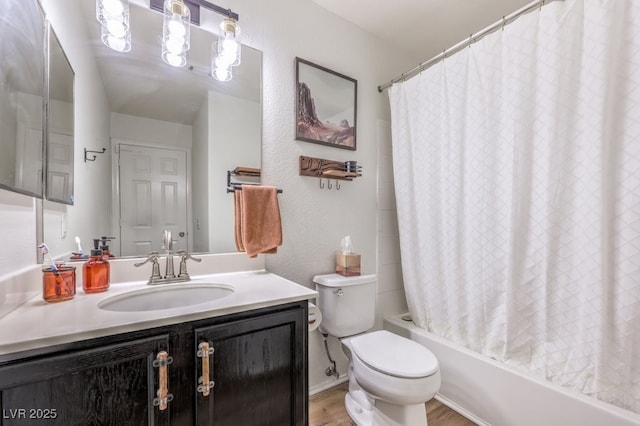 full bathroom with vanity, shower / bathtub combination with curtain, wood-type flooring, and toilet