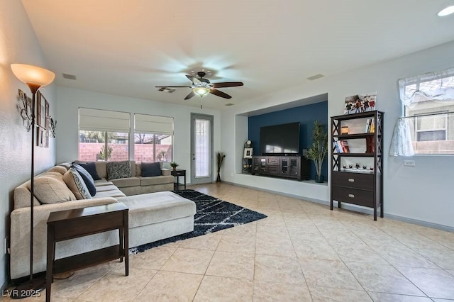 living room featuring ceiling fan and light tile patterned floors