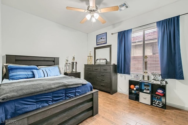 bedroom with ceiling fan and light wood-type flooring