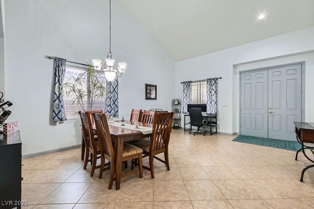 dining room featuring a notable chandelier, plenty of natural light, light tile patterned floors, and high vaulted ceiling