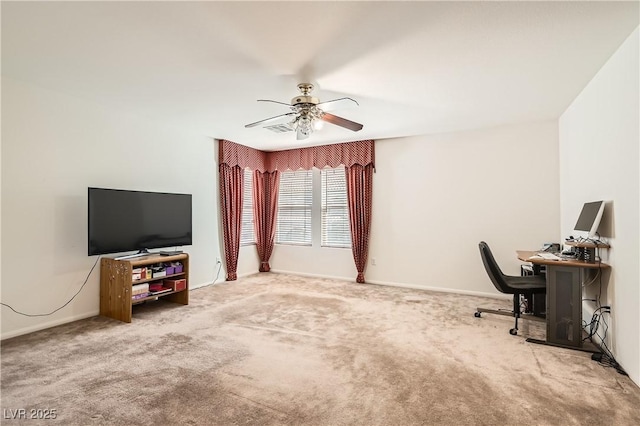 office with baseboards, carpet, visible vents, and a ceiling fan