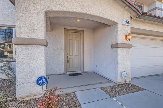 entrance to property featuring a garage