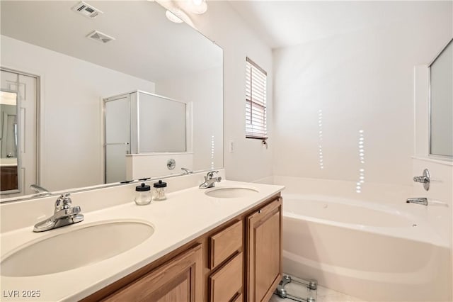 11276 Accademia Ct, Las Vegas, NV 89141 - bathroom with a bath, double vanity, and a shower stall