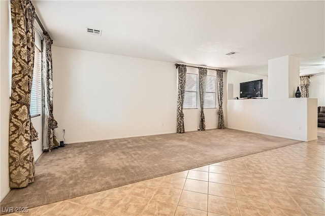 11276 Accademia Ct, Las Vegas, NV 89141 - empty room with light colored carpet and light tile patterned floors