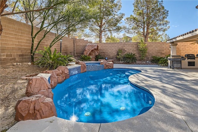 11276 Accademia Ct, Las Vegas, NV 89141 - view of pool with area for grilling, a fenced backyard, a pool with connected hot tub, and a patio