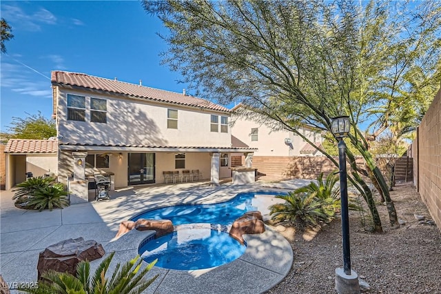 11276 Accademia Ct, Las Vegas, NV 89141 - rear view of property featuring stucco siding, a fenced backyard, french doors, a pool with connected hot tub, and a patio area