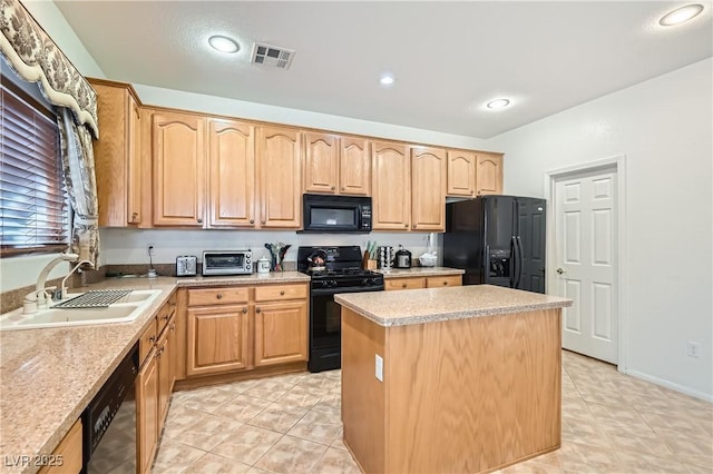 11276 Accademia Ct, Las Vegas, NV 89141 - kitchen with black appliances, a sink, light brown cabinets, a kitchen island, and light countertops