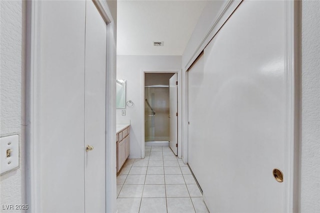 bathroom with tile patterned flooring and vanity