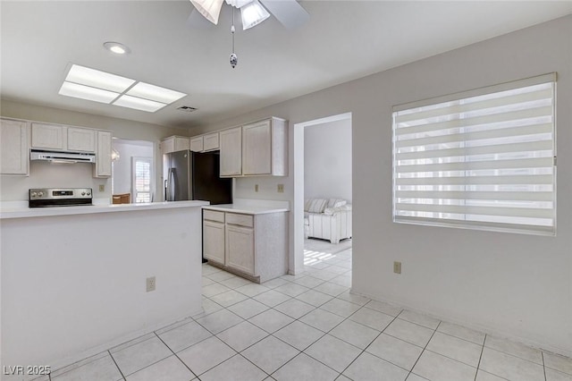 kitchen featuring stove, white cabinets, stainless steel refrigerator with ice dispenser, ceiling fan, and light tile patterned floors