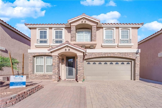 mediterranean / spanish-style home featuring a garage